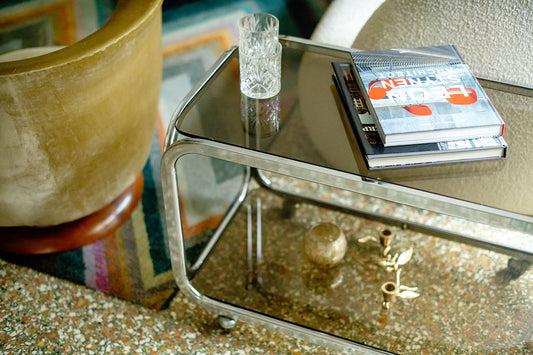 Elegant glass-topped trolley with rounded curves